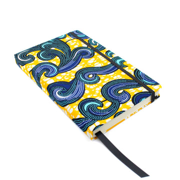 custom wellness journal for self care journaling by zenit journals with bright blue waves on sunny yellow backdrop