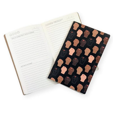 starter self care journal for self care journaling, journal prompts and brown cover with raised fists