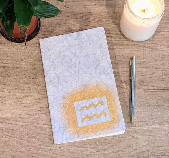 astrology wellness journal with candle