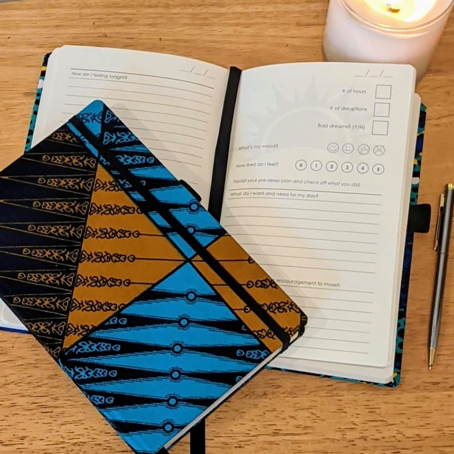 sleep journal by zenit, one closed with blue and brown print cover, one open with prompts for tracking sleep and practicing self-care for the day