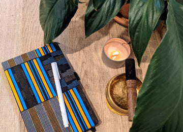 Journal Retreat on Processing Trauma with custom wellness journal, candle, plants